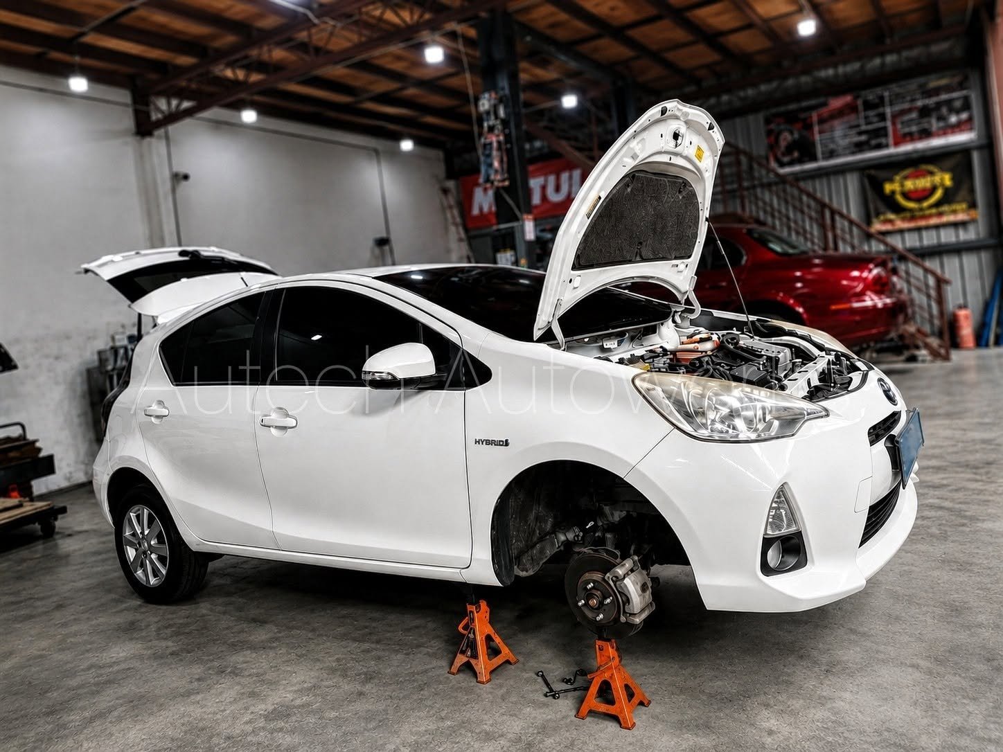 Under-bonnet auto mechanical checking at Senadin garage