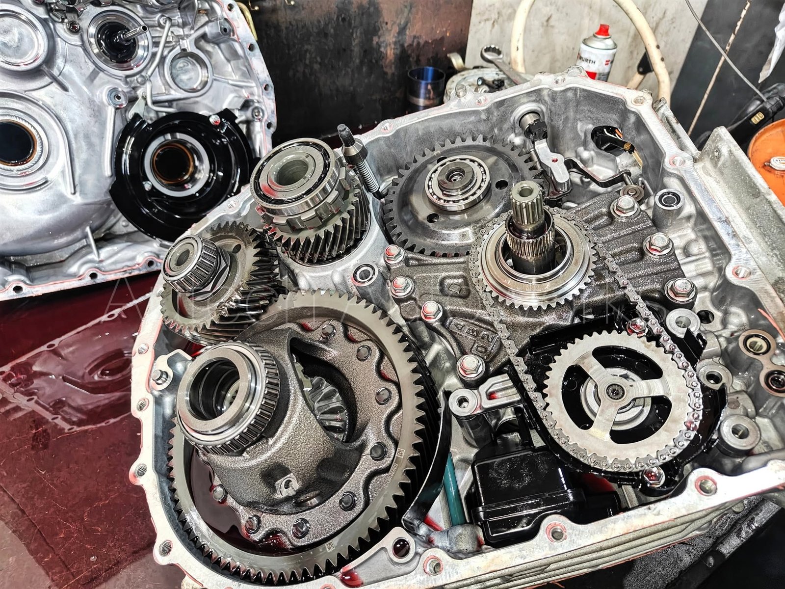 Car technician skimming brake disc with expert equipment